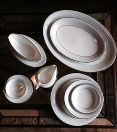 Nearly a full 12 place setting set of  Noritake "Bluetta" china. One coffee cup missing. Make an offer. $100. OBO