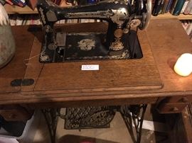 Antique sewing machine with cabinet singer 400.00