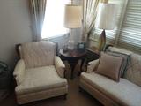 Elegant Mid Century Armchair with Mid Century Lamps surrounding.