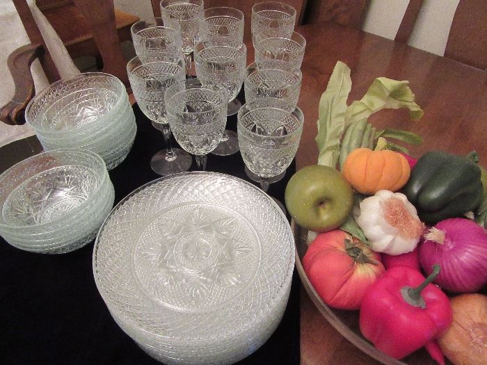 set of dishes and wine glasses for holiday entertaining!  Artificial veggies in a bowl