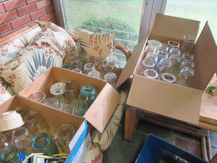 collection of vintage Bell canning jars with glass lids, milk bottles, etc.