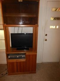 Open view of entertainment center & 1 0f 2 flat screen tvs 