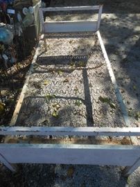 Heavy metal cot/ could be a "flower bed"