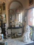 A Pair of Black Marble Top Ebonized & Gilded Consoles & Palladium Mirrors From the Cleveland Play House, 19th Century Italian Marble Lions, French Chenets, Lucite Floor Lamp, French Clock w Garnitures