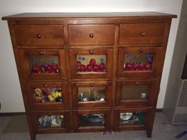 Gorgeous drawer cabinet. Personalize glass window boxes with photos or any decorative touches you choose.