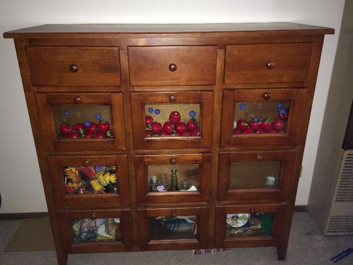 Gorgeous drawer cabinet. Personalize glass window boxes with photos or any decorative touches you choose.