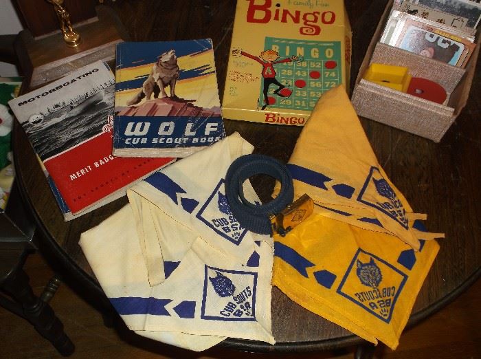 Cub Scout scarves, belt, and books 