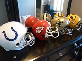 Black dresser and mirror....Football helments KC Chiefs, LSU, New Orleans, Houston