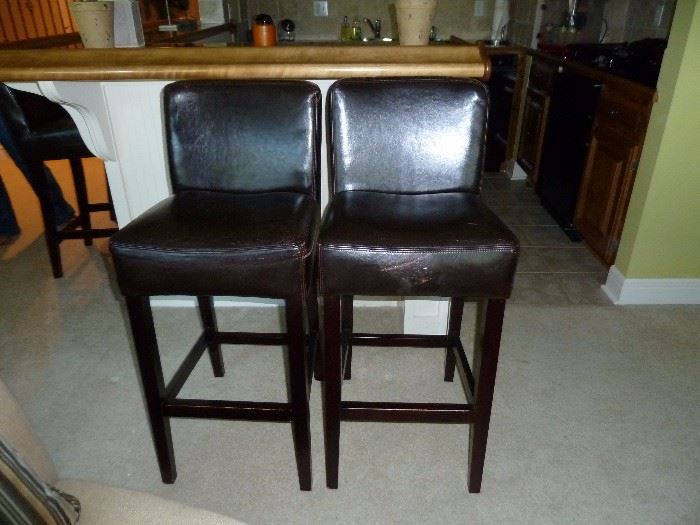 Four leather bar stools