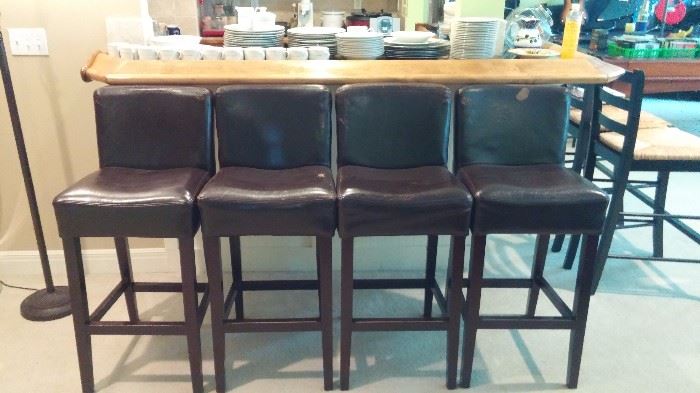 four leather bar stools