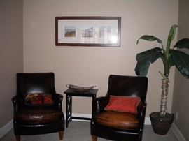 Distressed leather club chairs