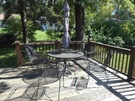 Iron patio set table with 4 chairs and umbrella