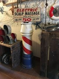 Antique barber pole with scalp massage sign