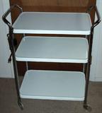 Serving cart with handle and electrical outlet (never used) from the 1950's - in perfect condition.