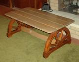 Wood Coffee Table with wagon wheel design supports.