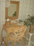 Located in main bath alcove - very pretty wicker vanity and chair.