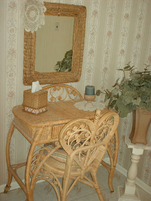 Located in main bath alcove - very pretty wicker vanity and chair.