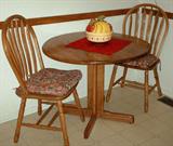Small kitchenette.  Oak with 2 chairs in excellent shape.