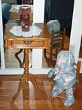 Oak pedestal phone table with a few of the unusual collectibles in the formal living room.