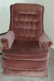Rose upholstered swivel rocker.  Great sitting room chair.
