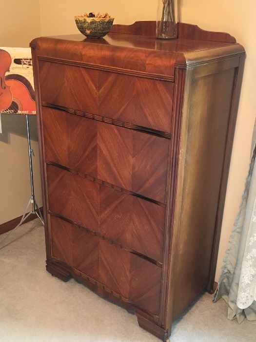 1930's-1940's mid-century, art-deco, herringbone texture solid wood tall boy dresser. Part of a set including a full size bed frame with mattress & boxspring, and low dresser with mirror. 
