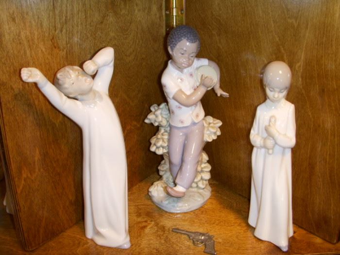 Lladro figurines, and a tiny toy gun