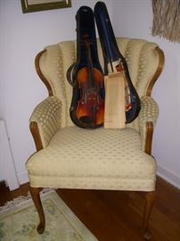 Curved back chair displaying the violin made in Czechoslovakia
