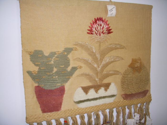 Another woven wall hanging, this one retains label indicating origin from India