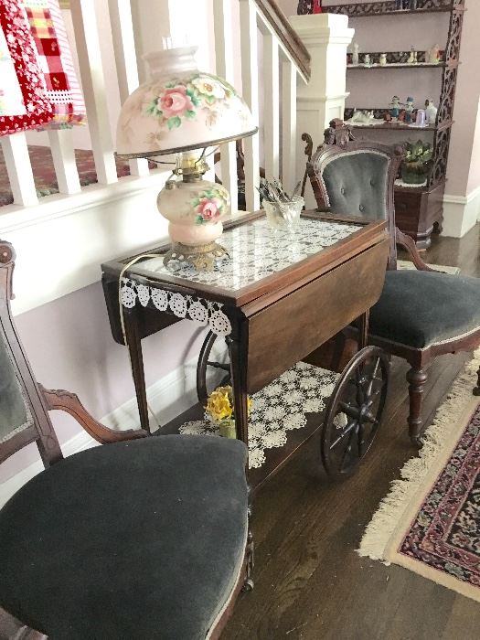 Living Room: Tea Cart, maple wood, dark finish. In sound condition.     Two side chairs, original upholstery in nice condition. Casters on feet. 