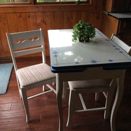 Kitchen: Porcelain top table and 2 chairs.