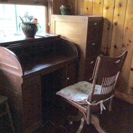 Kitchen: Rolltop desk and swivel chair. Oak. Also, file cabinet in corner.