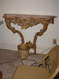 There are a pair of these fabulous hall tables with marble tops