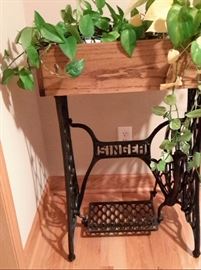 treadle sewing machine base made into a plant stand