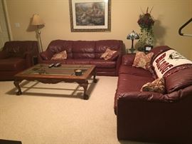 Matching leather sofas, chair and ottoman. Coffee table