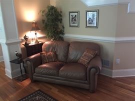 Leather love seat, Chinese medicine cabinet.