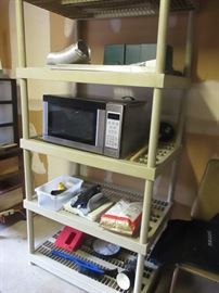shelf unit, microwave, various items