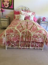 Adorable  custom pink toile bedding and iron bed.  Many cream accent furniture pieces.