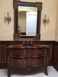 The vanity is offered for sale.  Mirror and sconces as well.  