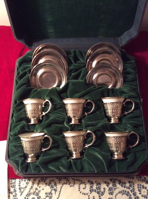 Sterling cased demitasse cups with sterling saucers - there are 2 cased sets 