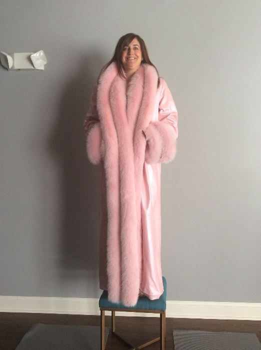 Full length bubblegum pink lambskin coat with full wrap and deep cuffs of dyed fox.  Rhinestone enhanced collar and cuffs. Size 16 