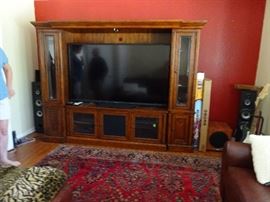 entertainment center and 70" TV