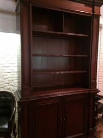 Very tall handsome bookcase with lower storage