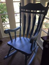 One of two blue wooden rockers
