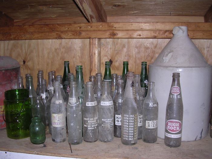 Large stoneware jug.  Vintage soda bottles, at least 3 times as many bottles as shown here.