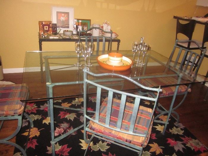 Glass top kitchen table with metal base and chairs