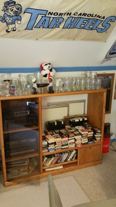 Entertainment center, 8 track tapes, DVD's, boot glasses (hundreDS in various sizes), dry erase board, coca cola items