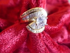 004 14k, .78 ct. solitaire, .55 ct. others