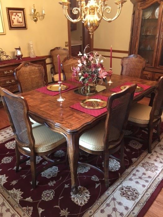 Elegant dining room set. There are 8 chairs, extra leaves and custom pads that are included.