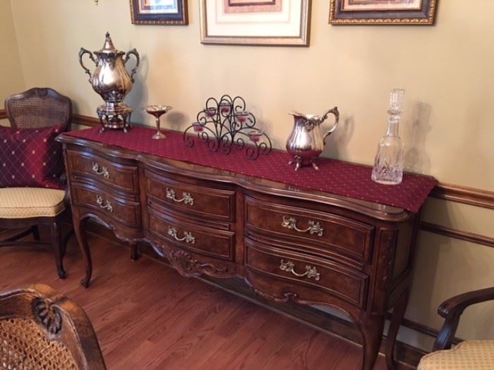 A view of the sideboard/buffet with tons of storage, beautiful lines, and quality throughout. Did I mention that everything in this house is in pristine condition??
