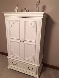 Really nice armoire is not too big and not too small. Will hold a TV or use it to store your computer and electronics.